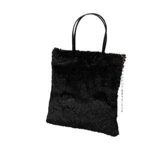 Minimalist black faux fur tote bag with slim handles and golden chain decoration