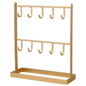 Golden iron jewelry organizer stand with double rows of hooks and a storage tray