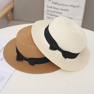 Elegant summer flat top straw hats in beige and khaki with black ribbon bow decoration