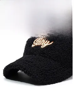 Detail of black faux lamb wool baseball cap featuring white Gary letter embroidery