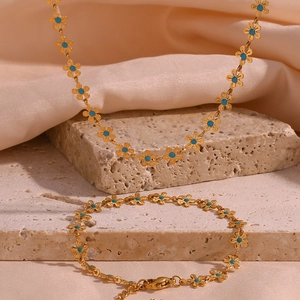 18K gold plated necklace and bracelet set with blue floral charms on silk and stone