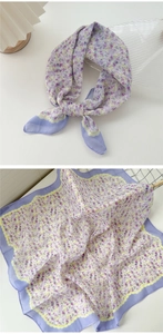 Detailed view of lavender floral cotton-linen scarf showing edge stitching and texture
