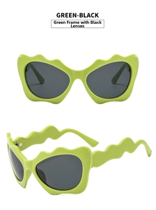 Detail of green wavy frame sunglasses with dark lenses and scalloped temple design