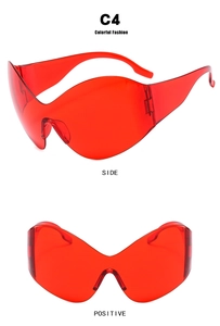 Detailed front and side views of red Y2K futuristic rimless oversized sunglasses