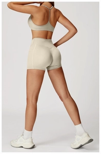 Detail of high-waisted yoga shorts with crossover waistband and functional side pockets