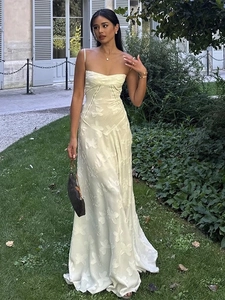 Elegant cream slim fit strap maxi dress with 3D butterfly embroidery in outdoor garden