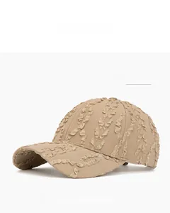 Detail shot of the khaki seersucker textured baseball cap with ruffled stripe fabric