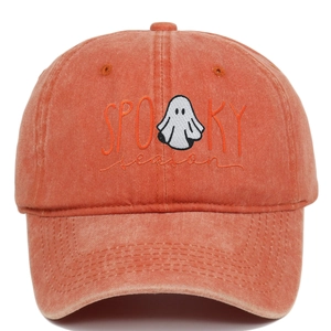 Orange washed baseball cap with ghost embroidery and Spooky Season text on front