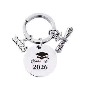 Detailed view of silver stainless steel Class of 2026 graduation keychain with charms