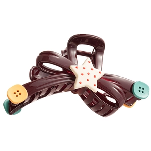 Burgundy acrylic star button bow hair claw clip with polka dots on white background