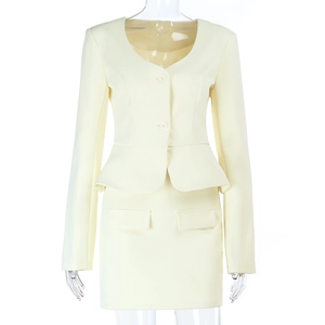 Detail of cream peplum blazer set featuring a slim fit cut and double button closure