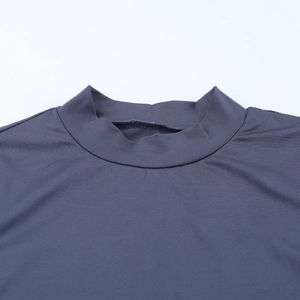 Detail of mock neck stitching and dark gray knit texture on long sleeve dress