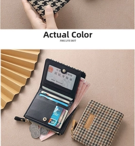 Detail of small houndstooth wallet showing card slots, ID window, and coin zipper pocket