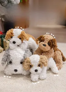 Group of cute plush puppies in various colors shown in a warm home gift setting