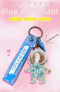 Blue astronaut liquid glitter keychain with Dream On strap and transparent figurine