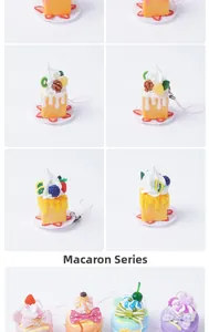 Detailed view of miniature PVC cake pendants with colorful macaron and cream textures
