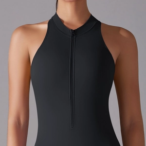 Close-up of black sleeveless yoga jumpsuit featuring a half-zipper and high stand collar