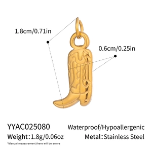 Detailed view of 18K gold plated stainless steel cowboy boot charm with engraved patterns