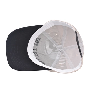 Detail view of cotton baseball cap interior with letter print lining and adjustable strap