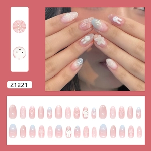 Pink and blue gradient press-on nails with 3D bunny, floral designs, and pearl accents