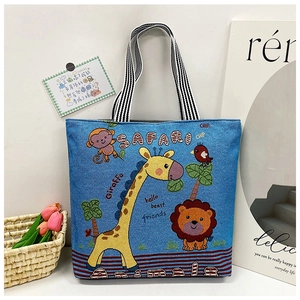 Detail of safari animal embroidery and striped handles on the blue canvas tote bag