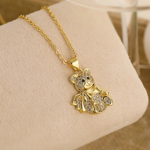 Macro shot of 18K gold plated bear pendant with sparkling cubic zirconia inlay detail