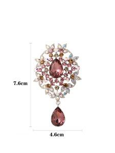 Detailed view of vintage crystal brooch showing 7.6cm by 4.6cm size measurements