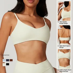 Cream white quick-dry sports bra for women with thin straps and hollow open back design
