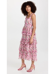 Detail of tiered pink floral dress showing layered skirt and lightweight fabric texture