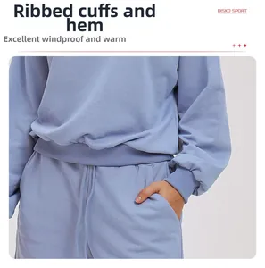 Detailed close-up of ribbed cuffs and hem on a blue-purple casual crewneck sweatshirt