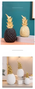 Close-up of resin pineapple decor with diamond textures and golden leaf details