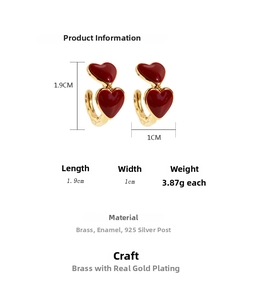 Detailed view of red enamel heart earrings with brass base and 925 silver needles
