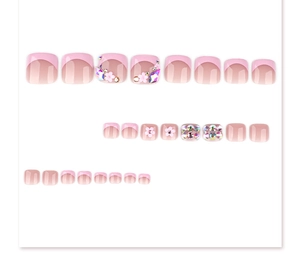 Detail of pink French toenail press-ons featuring 3D flowers and sparkling rhinestones