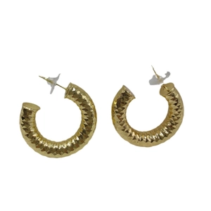 Golden C-shaped hoop earrings with diamond-cut textured surface on a white background