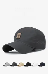 Detail of lightweight quick-dry baseball cap with breathable mesh and brown leather logo tag