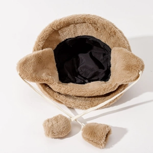 Brown plush winter bucket hat with faux rabbit fur earflaps and fuzzy pompom ties