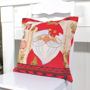 Standard square Santa Claus throw pillow cover in red linen blend on a white chair