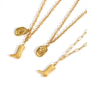 Detail of 18k gold plated western cowboy boot and hat pendant layered necklaces