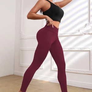 Slim fit high waisted burgundy yoga leggings with moisture wicking quick dry fabric