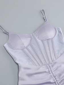 Detail of lavender satin corset top with sheer mesh paneling and boning structure