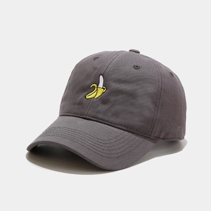 Close-up of grey cotton baseball cap featuring detailed yellow banana embroidery
