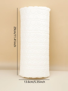Macro detail of white heart-embossed nail armrest cushion with precise dimensions