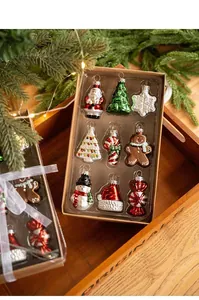 Set of 9 Christmas ornaments featuring Santa, snowman, and trees in a gift box