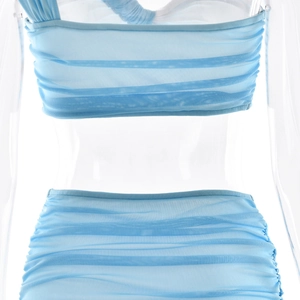 Detail of light blue mesh two-piece set featuring sheer pleated fabric on a mannequin