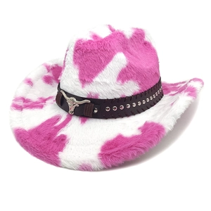 Detail of pink cow print faux fur cowboy hat with silver bull head ornament and studs