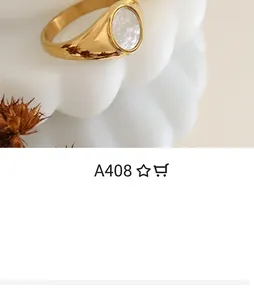 Detail of vintage 18K gold plated wide ring with elegant white shell inlay on top