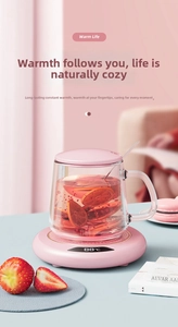 Pink smart constant temperature coaster with LED display showing 88°C and glass cup