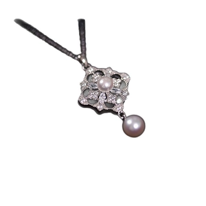 Elegant zircon diamond flower necklace with lavender pearls on white background