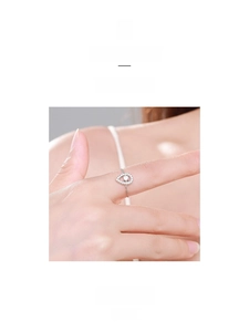 Detail shot of a teardrop-shaped S925 sterling silver ring with pavé diamond accents
