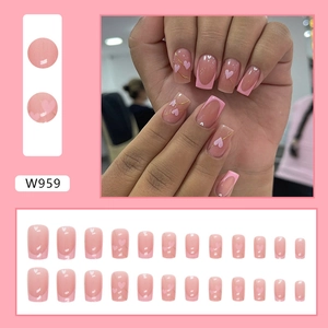 Detail of pink heart French tip press-on nails with gold lines set of 24 pieces